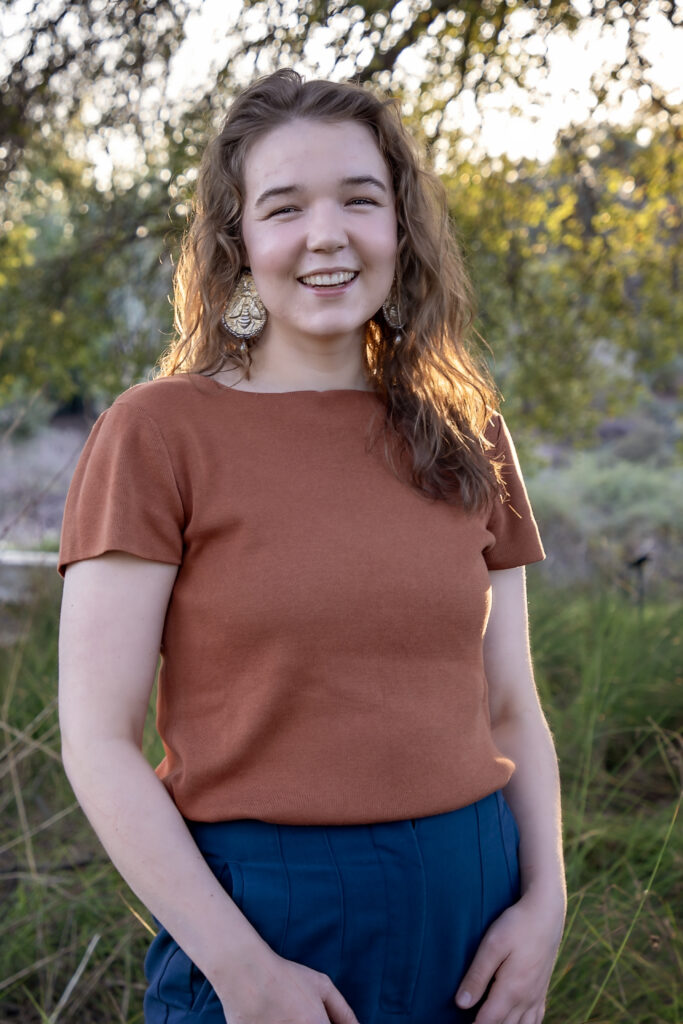 educational psychologist Rowan Foley standing and smiling in nature