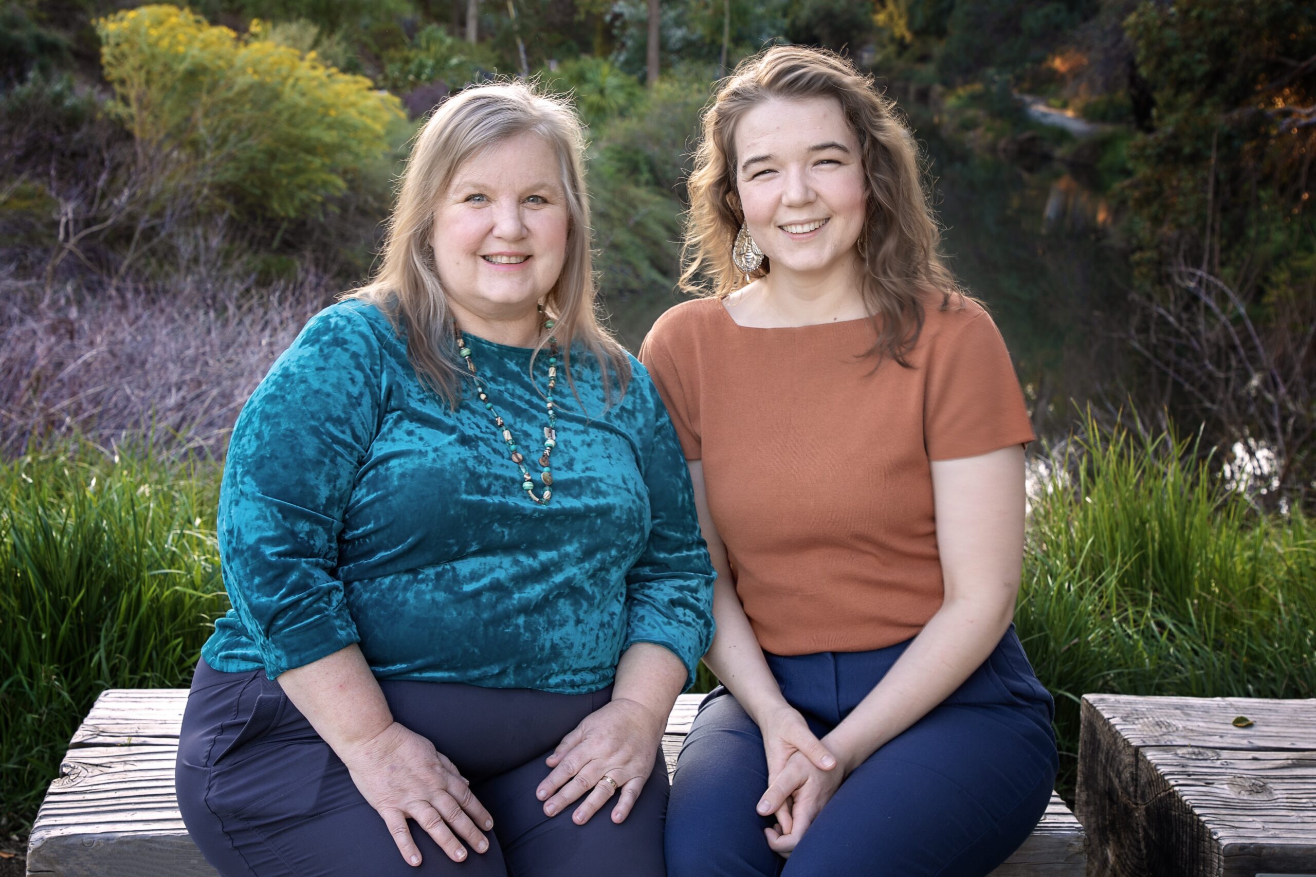 a tutor and educational psychologist sit side by side in a park